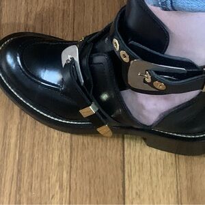 Balenciaga Black Leather Ankle Boots with Gold Hardware Accents